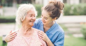 A young female caregiver and an elderly woman
