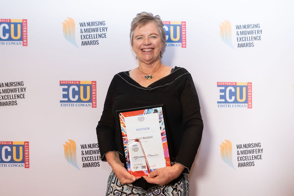 Perri-with-Award.jpg